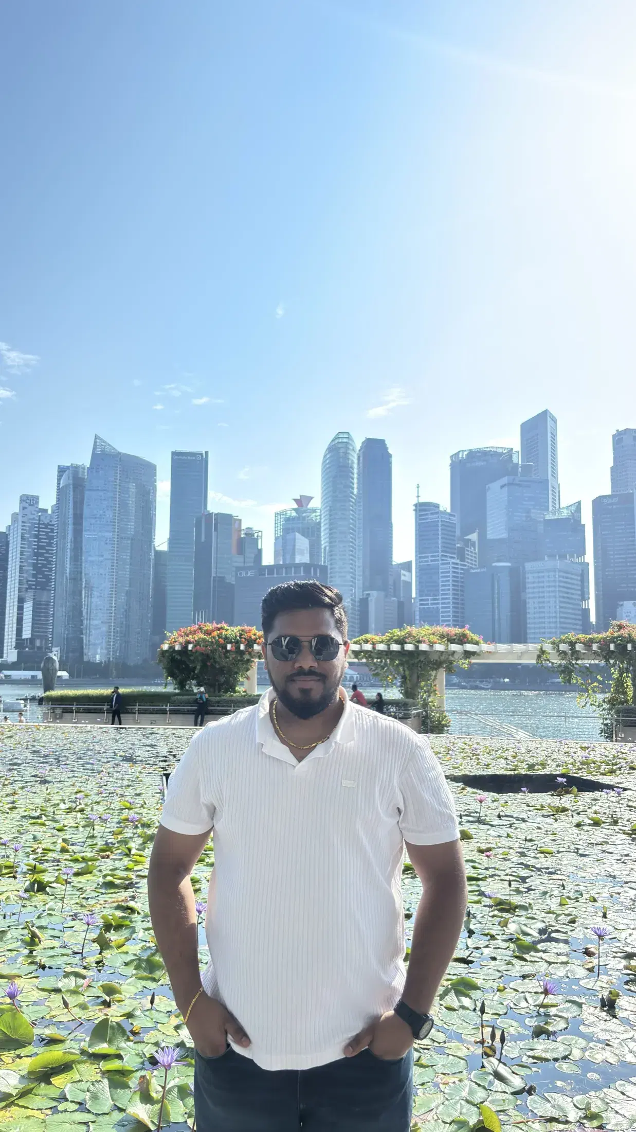 Manish in front of the ArtScience Museum lotus pond and Singapore skyline