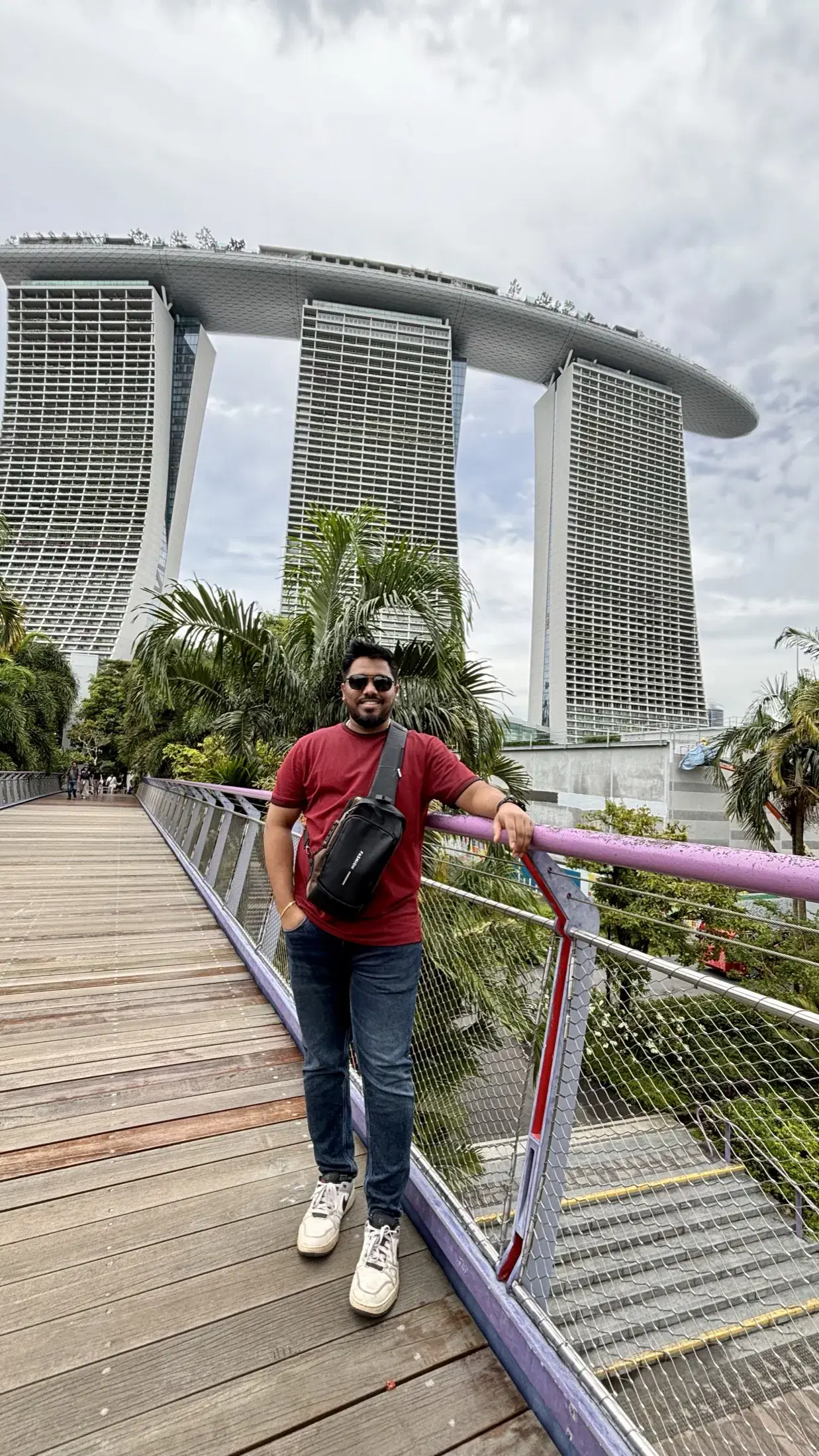 Manish on a garden walkway beneath Marina Bay Sands